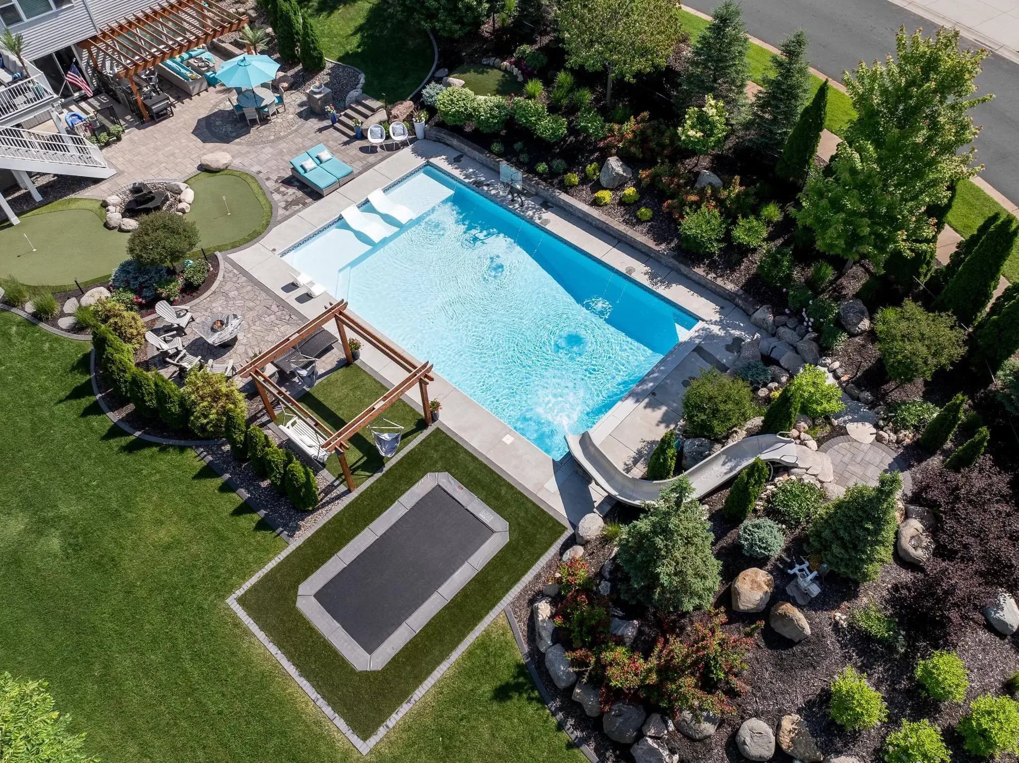 Overhead view of a beautiful backyard with an in-ground poool